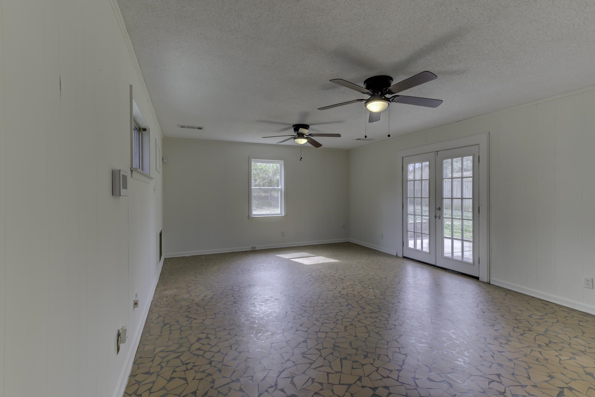 5077 New Castle Road Memphis, TN 38117 - Photo 30 of 37 wooden floor in an empty room with a window