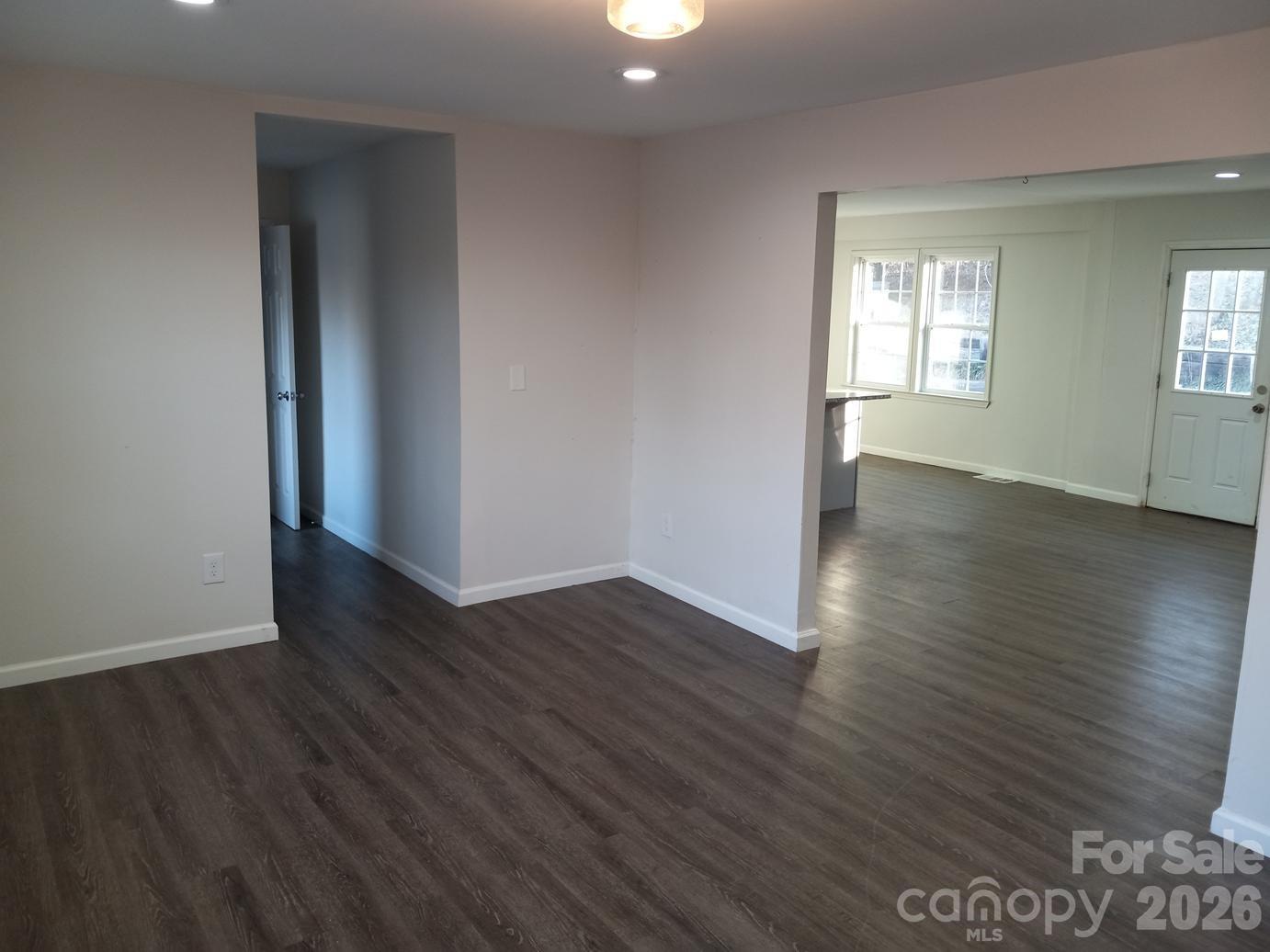 1110 Cherry Mountain Road Shelby, NC 28150 - Photo 2 of 19 an empty room with wooden floor and windows