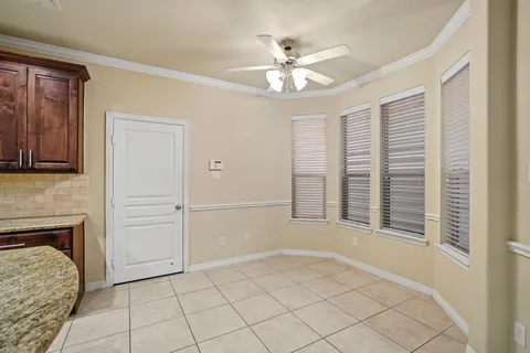 a view of an empty room with a fireplace