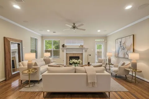 a living room with furniture and a fireplace