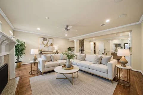 a living room with furniture and a fireplace