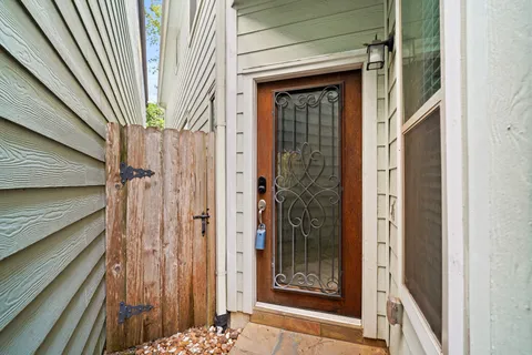 a view of a wooden door of the house