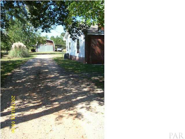 3333 Robinson Point Road Milton, FL 32583 - Photo 11 of 15 DRIVEWAY BESIDE HOUSE