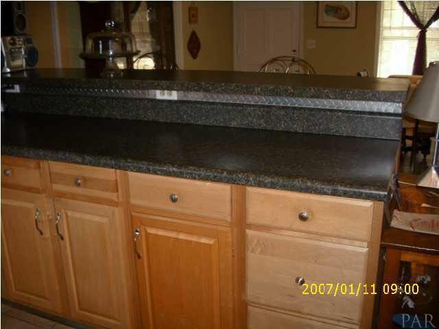 3333 Robinson Point Road Milton, FL 32583 - Photo 3 of 15 BEAUTIFUL COUNTERTOPS W/TONS OF WOOD CABINETS.
