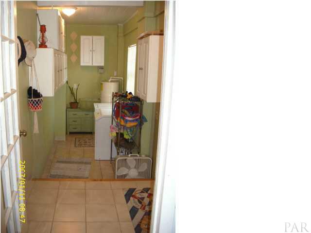 3333 Robinson Point Road Milton, FL 32583 - Photo 4 of 15 LAUNDRY ROOM OFF OF KITCHEN. PLENTY OF CABINETS FOR STORAGE. NICE SIZE ROOM.