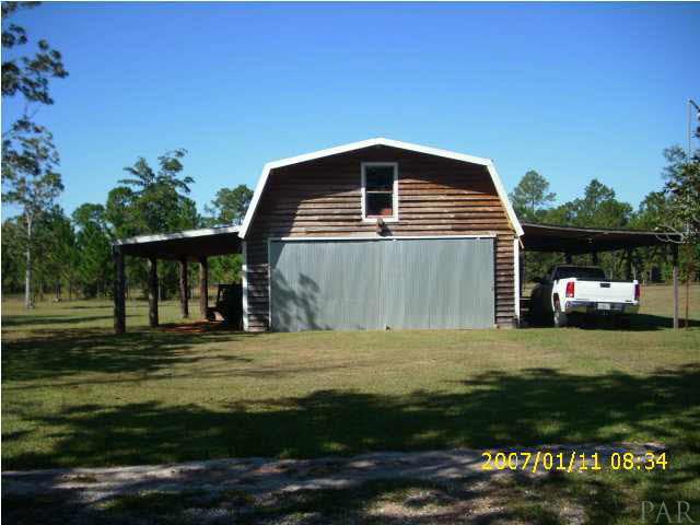 3333 Robinson Point Road Milton, FL 32583 - Photo 10 of 15 GARAGE/WORKSHOP - HUGE AREA - 220 ELEC. - OUTSIDE LIGHT BY SHOP.