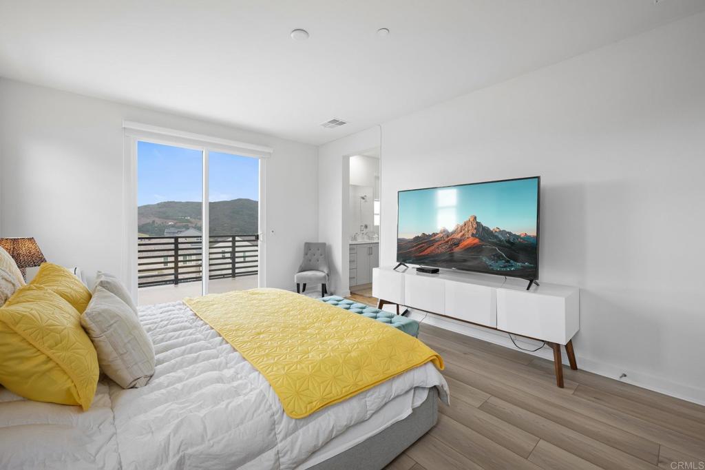 35152 Citrus Lane Fallbrook, CA 92028 - Photo 23 of 34 a bedroom with a bed and a flat screen tv