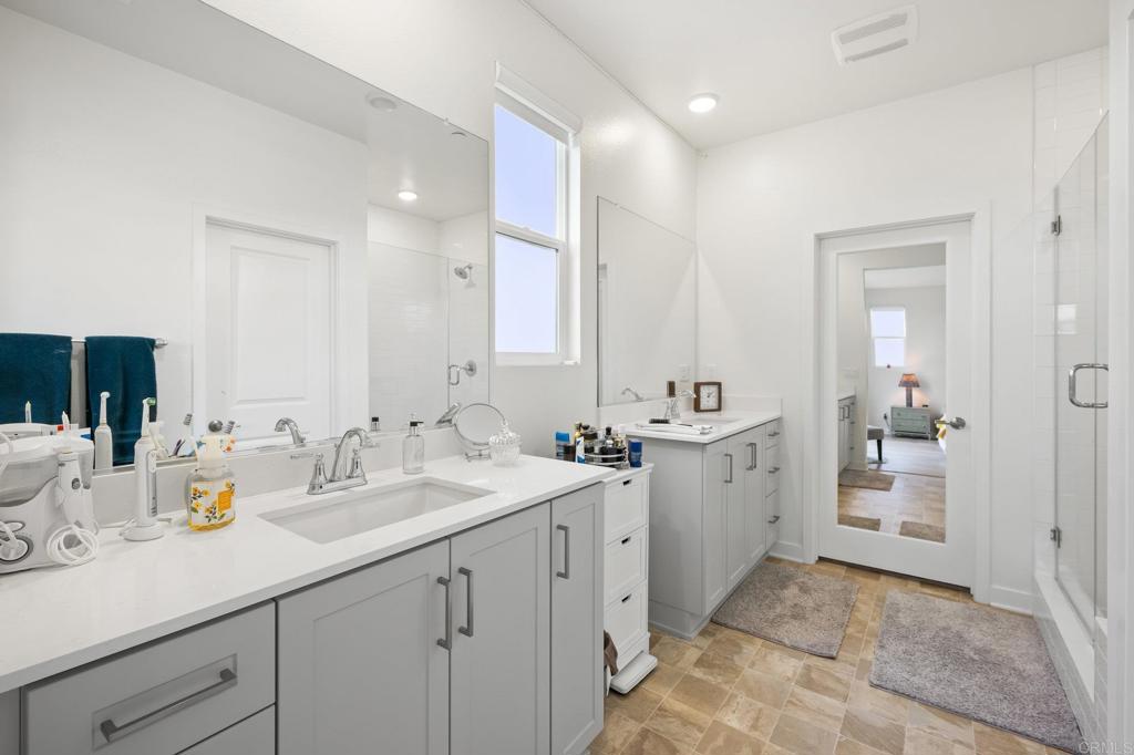 35152 Citrus Lane Fallbrook, CA 92028 - Photo 24 of 34 a spacious bathroom with a granite countertop sink mirror and double
