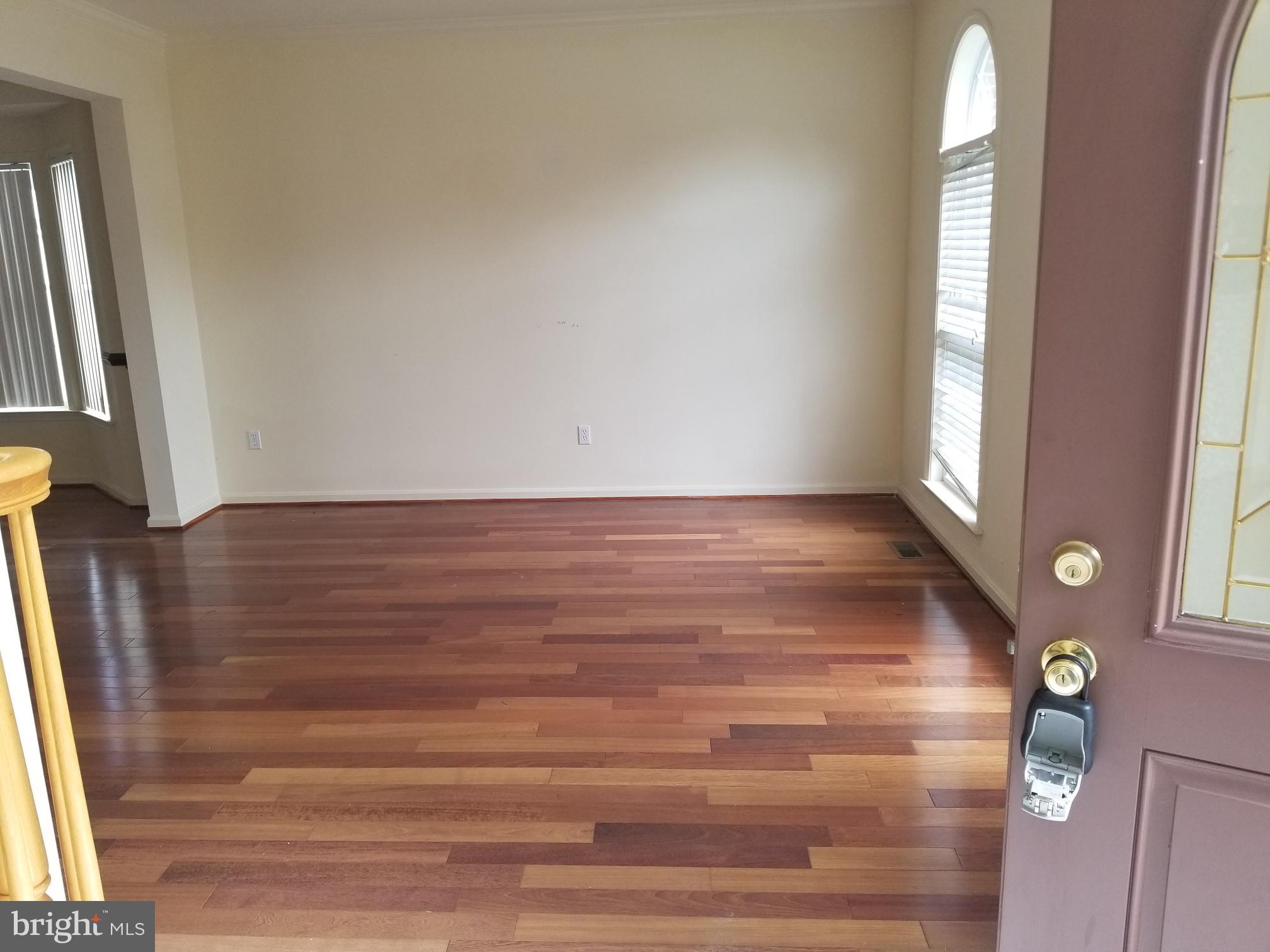 3943 Nelson House Road Ellicott City, MD 21043 - Photo 12 of 61 a view of empty room with wooden floor and fan