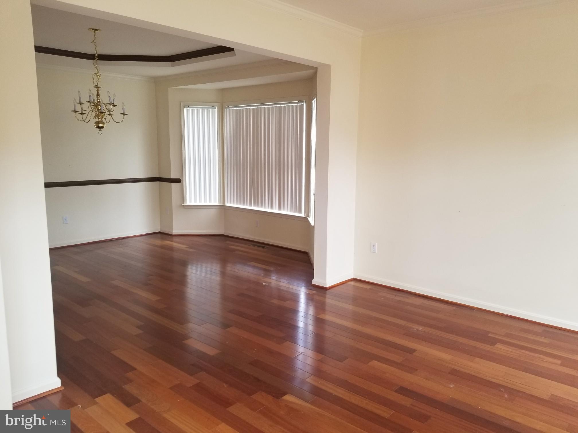 3943 Nelson House Road Ellicott City, MD 21043 - Photo 14 of 61 an empty room with wooden floor and a window