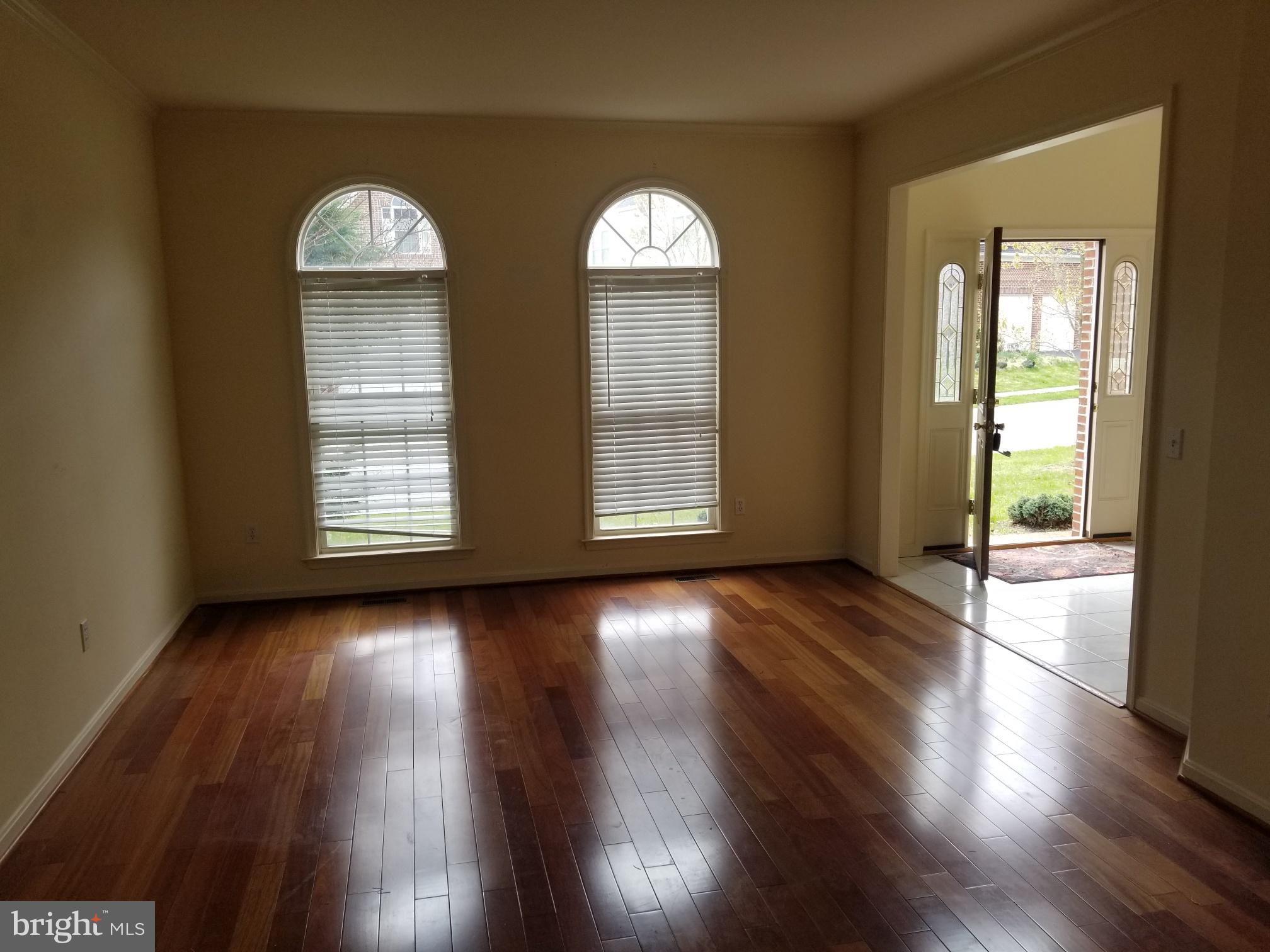 3943 Nelson House Road Ellicott City, MD 21043 - Photo 17 of 61 an empty room with wooden floor and windows