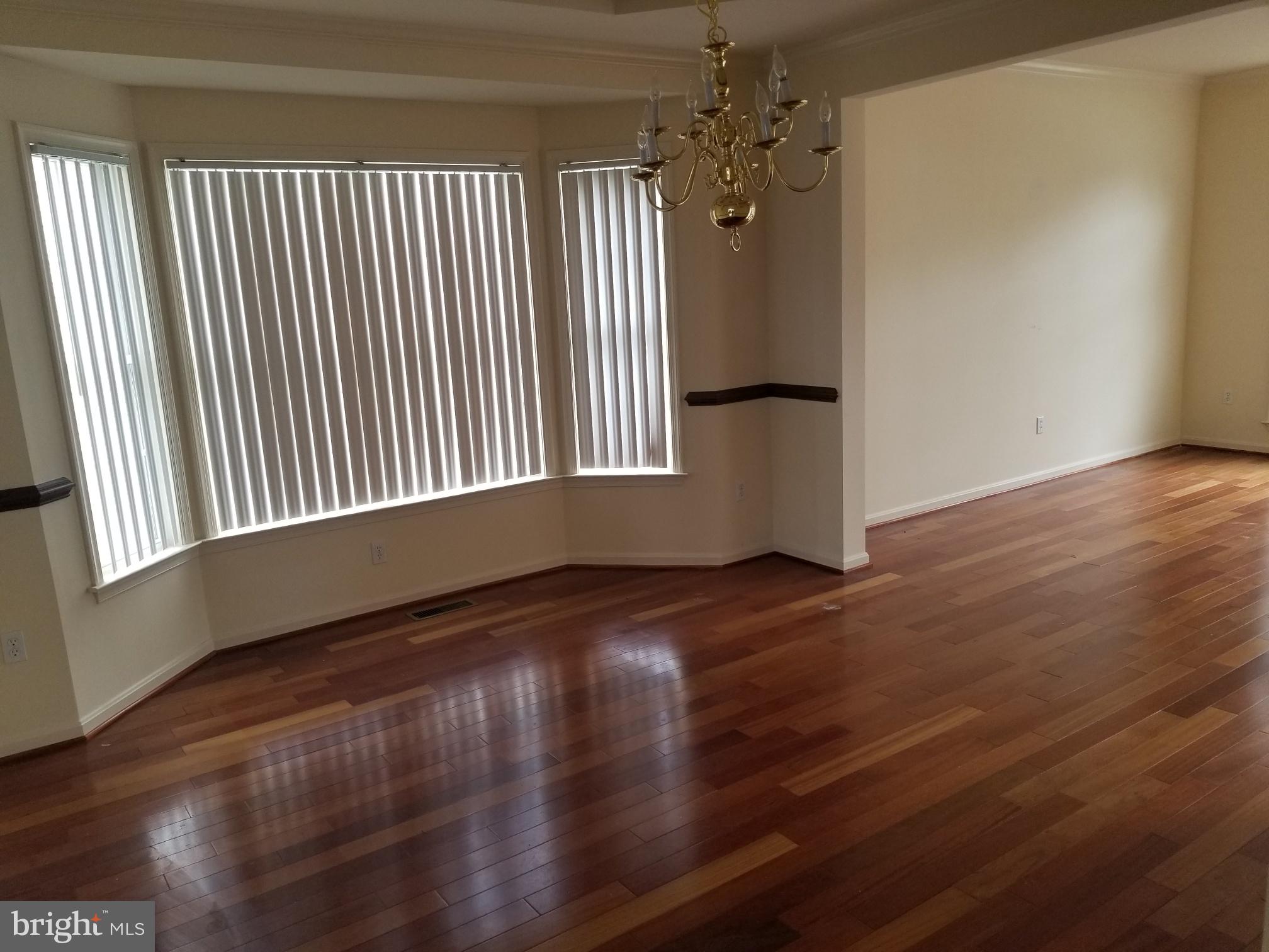 3943 Nelson House Road Ellicott City, MD 21043 - Photo 18 of 61 a view of empty room with wooden floor and fan