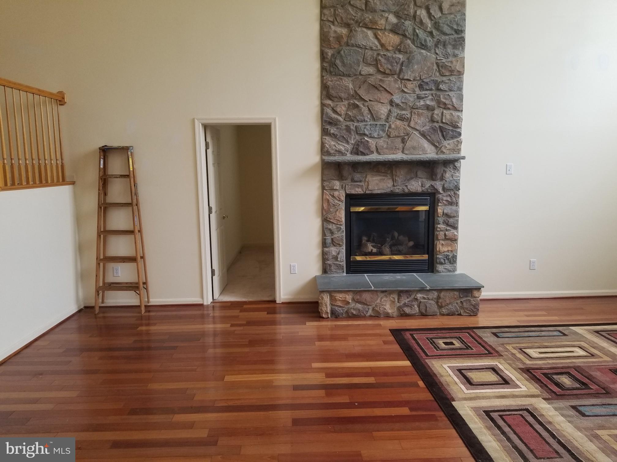 3943 Nelson House Road Ellicott City, MD 21043 - Photo 20 of 61 a living room with a fireplace