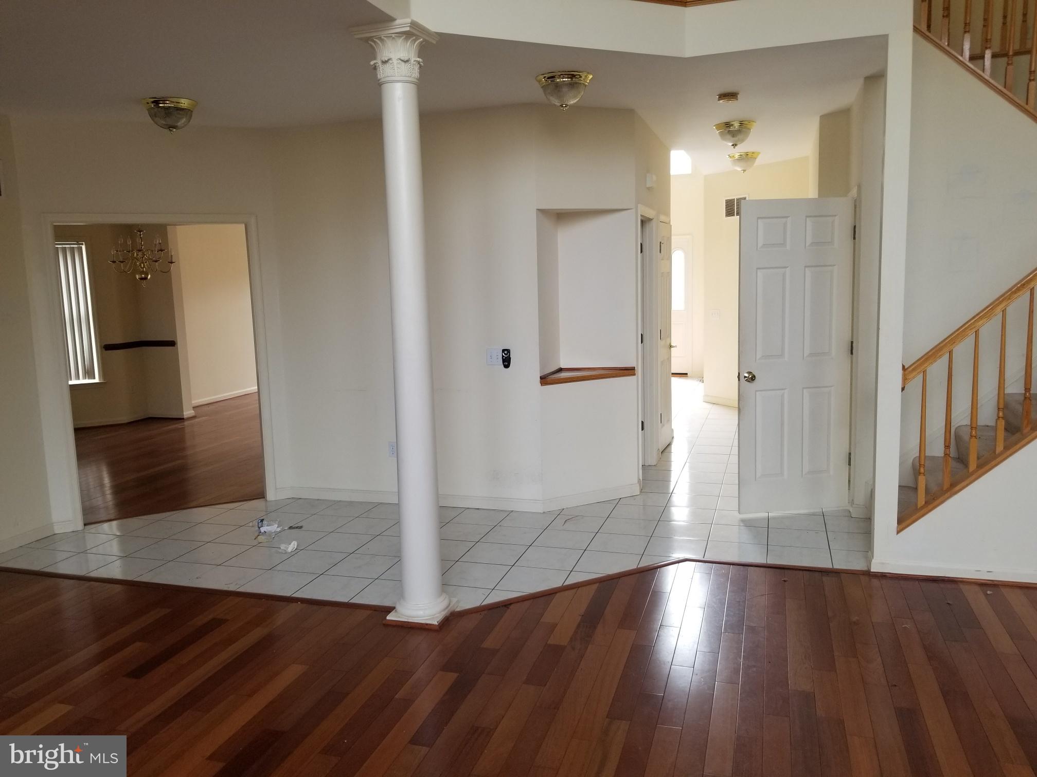 3943 Nelson House Road Ellicott City, MD 21043 - Photo 22 of 61 a view of a hallway with wooden floor