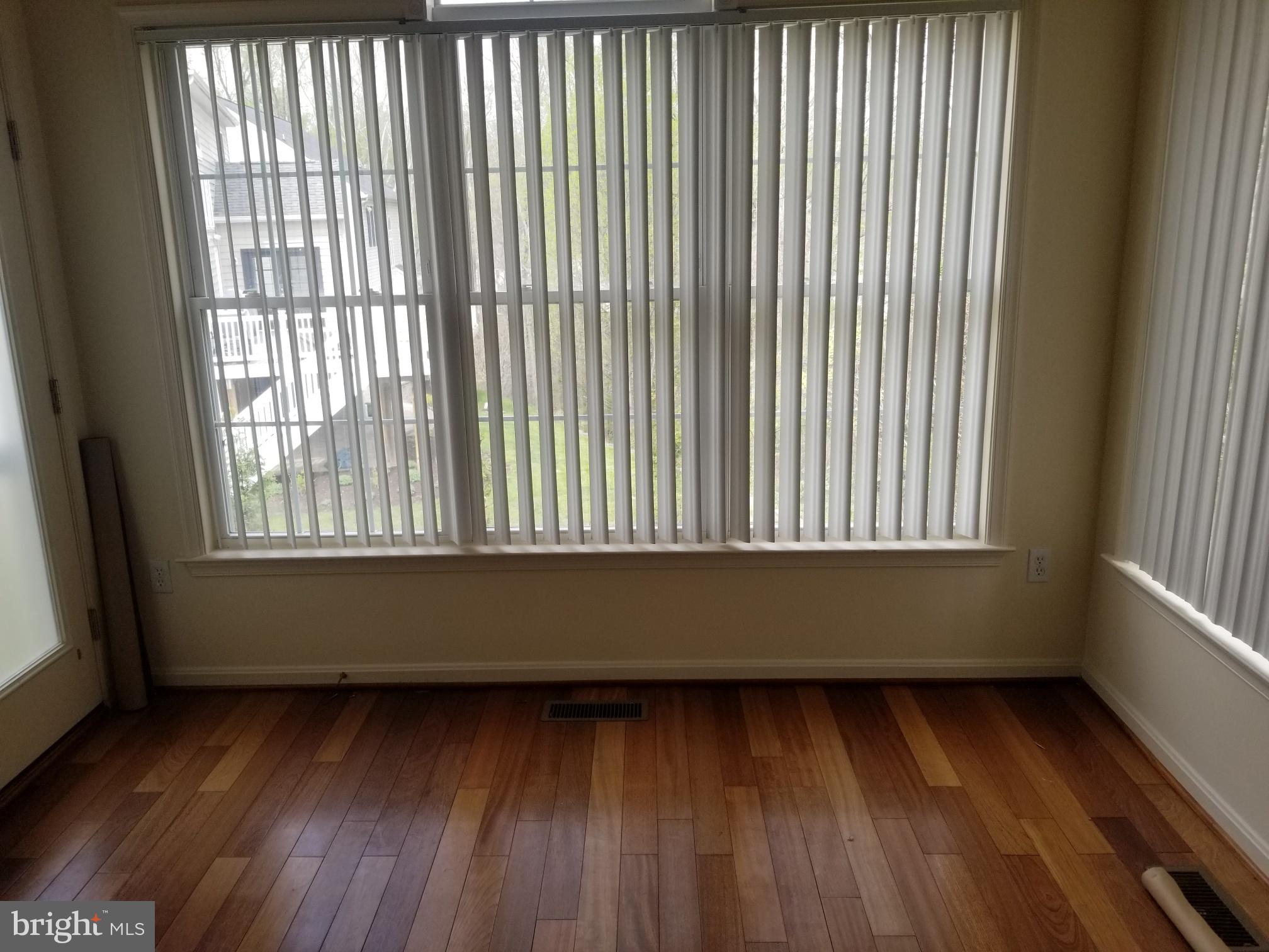 3943 Nelson House Road Ellicott City, MD 21043 - Photo 32 of 61 a view of a room with wooden floor and a window