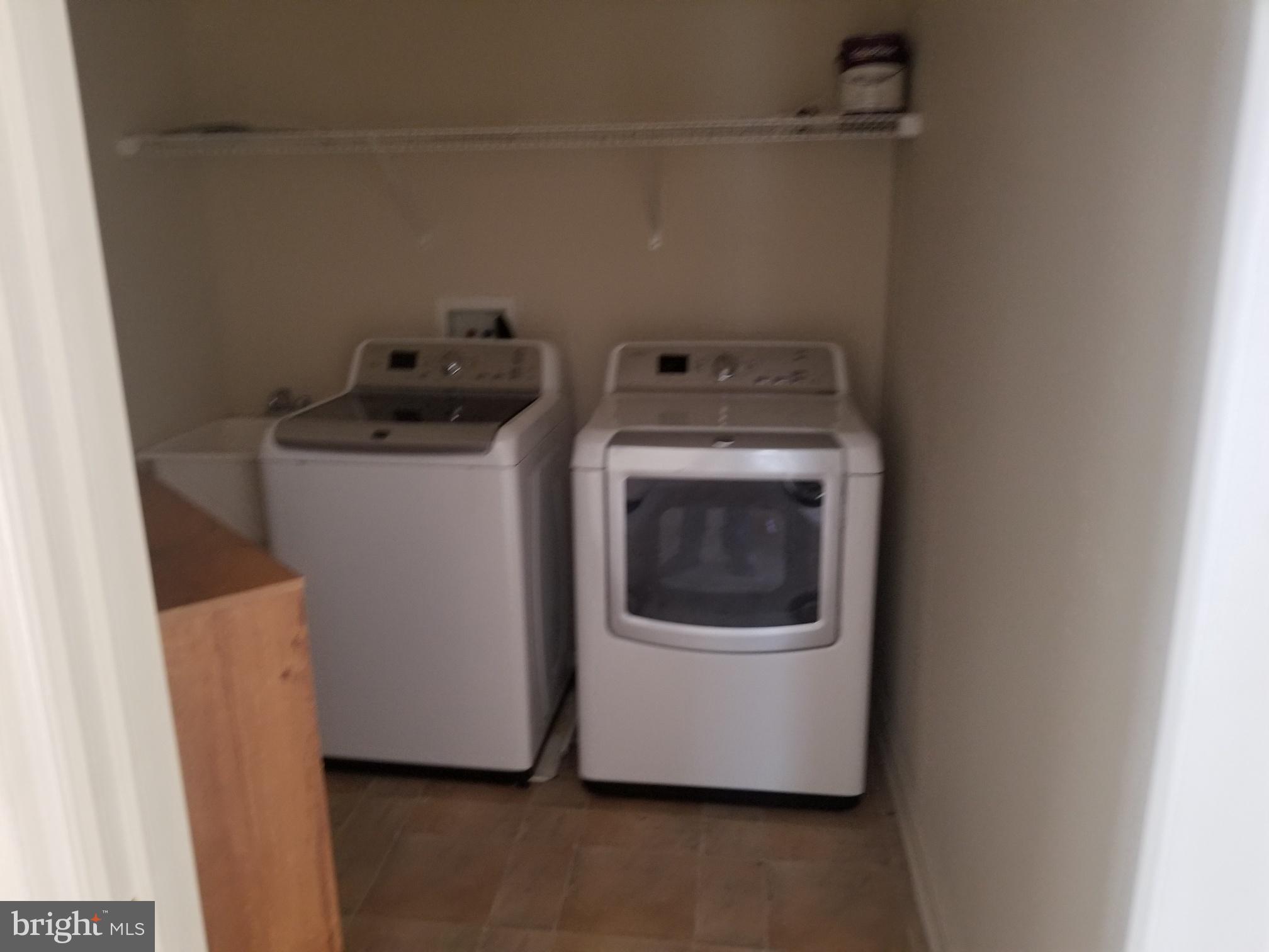 3943 Nelson House Road Ellicott City, MD 21043 - Photo 37 of 61 a utility room with wooden floor washer and dryer