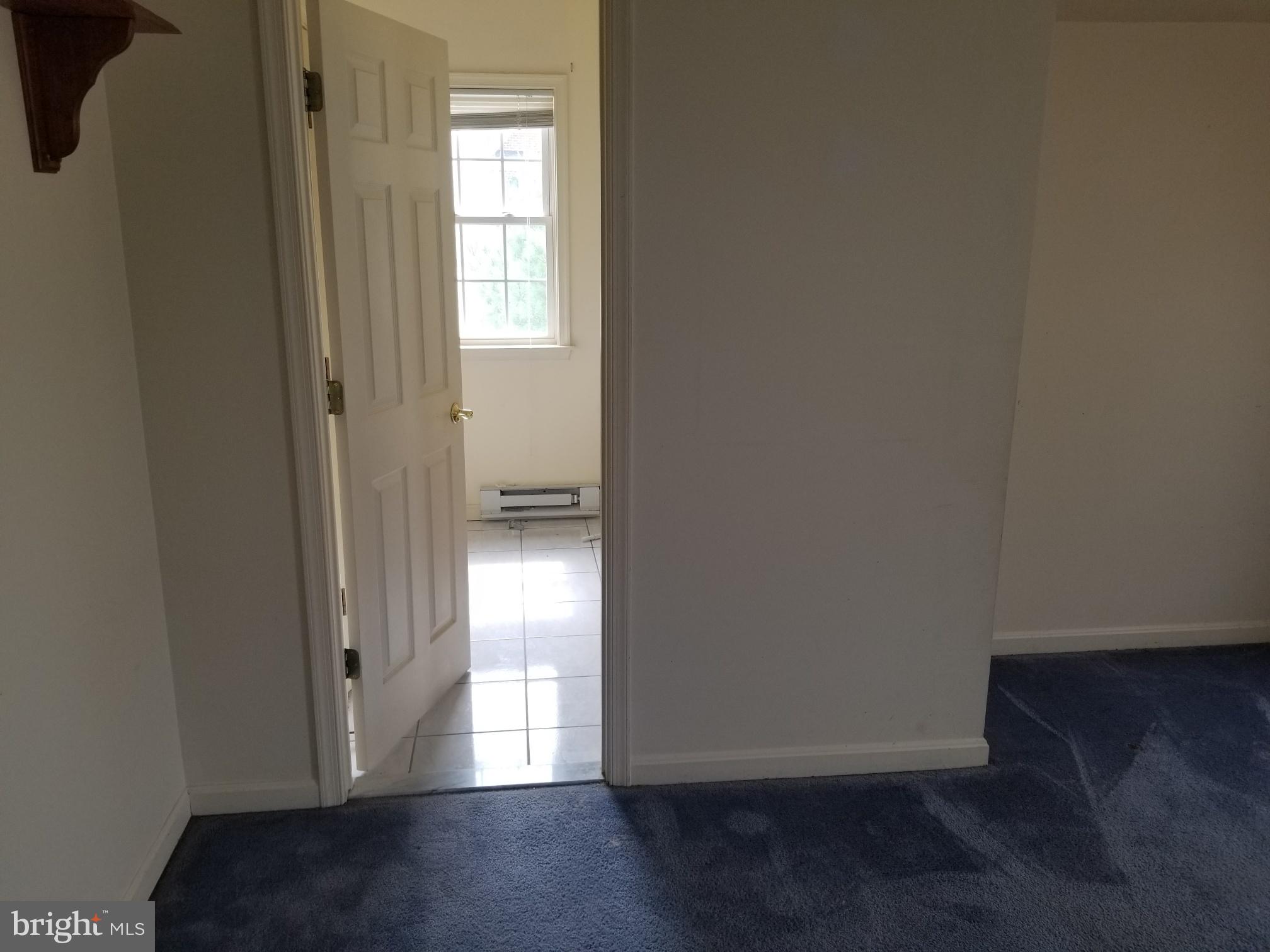 3943 Nelson House Road Ellicott City, MD 21043 - Photo 51 of 61 a view of empty room with wooden floor and fan