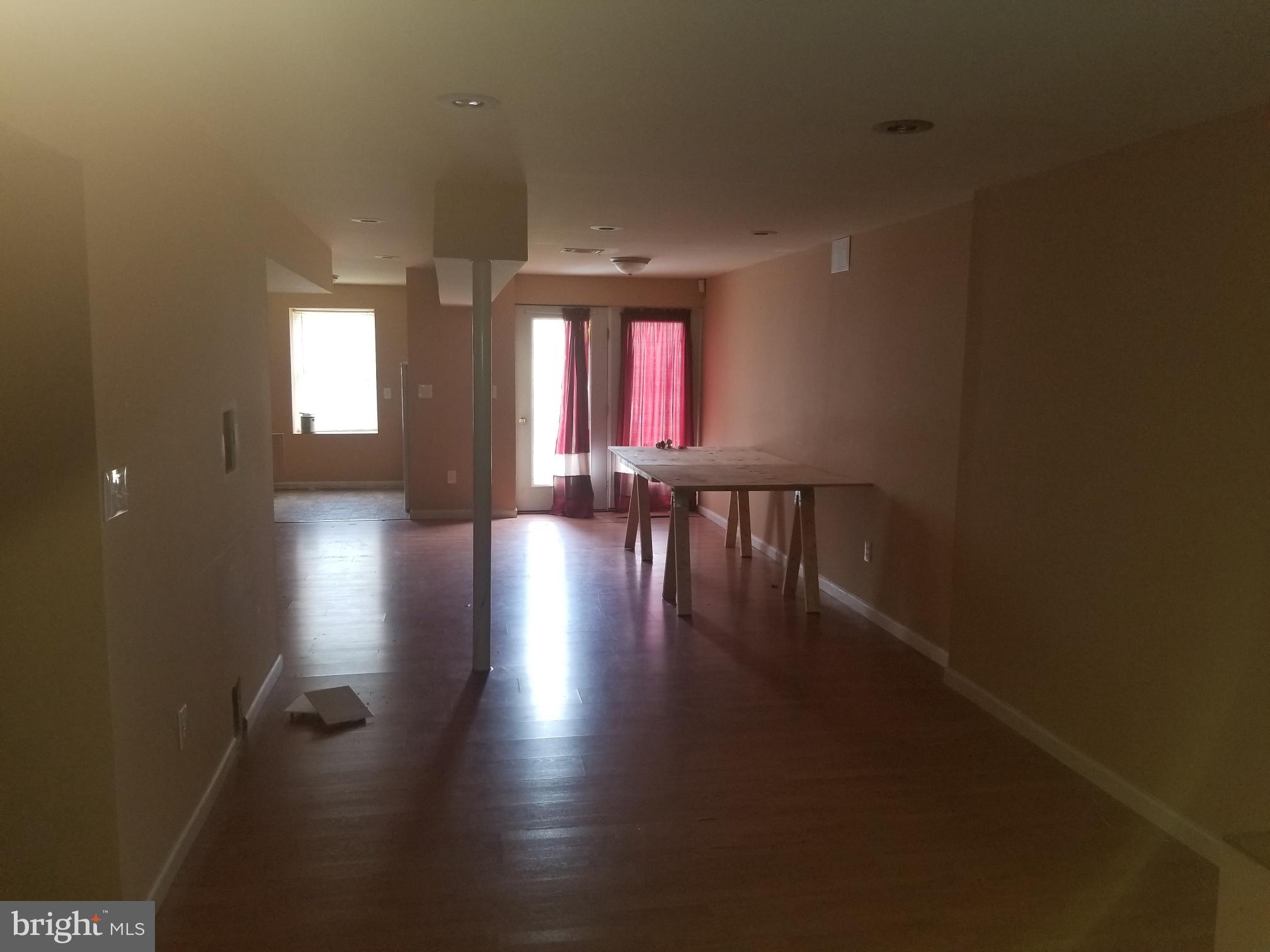 3943 Nelson House Road Ellicott City, MD 21043 - Photo 55 of 61 an empty room with wooden floor and windows