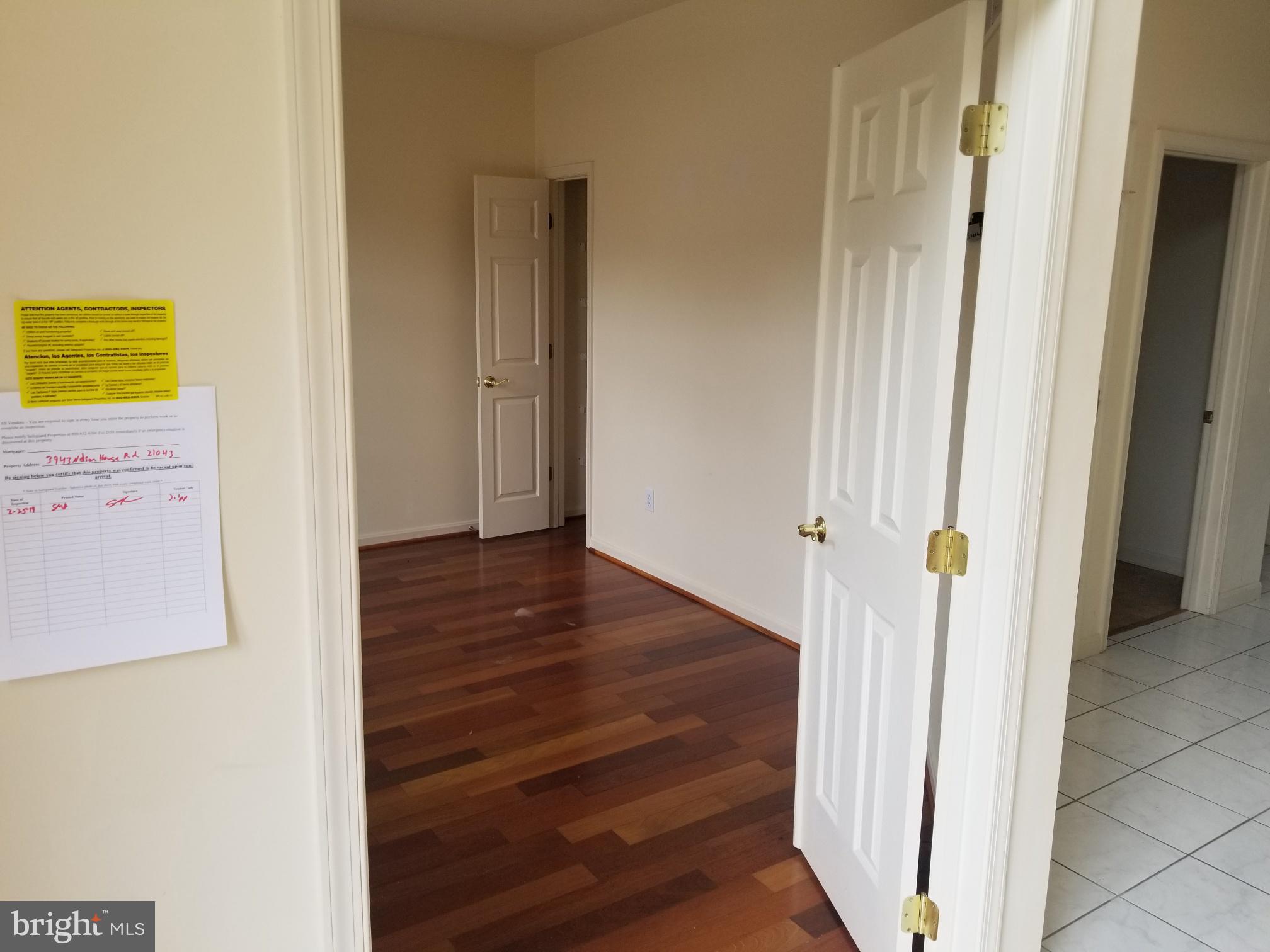 3943 Nelson House Road Ellicott City, MD 21043 - Photo 8 of 61 a view of a hallway with wooden floor
