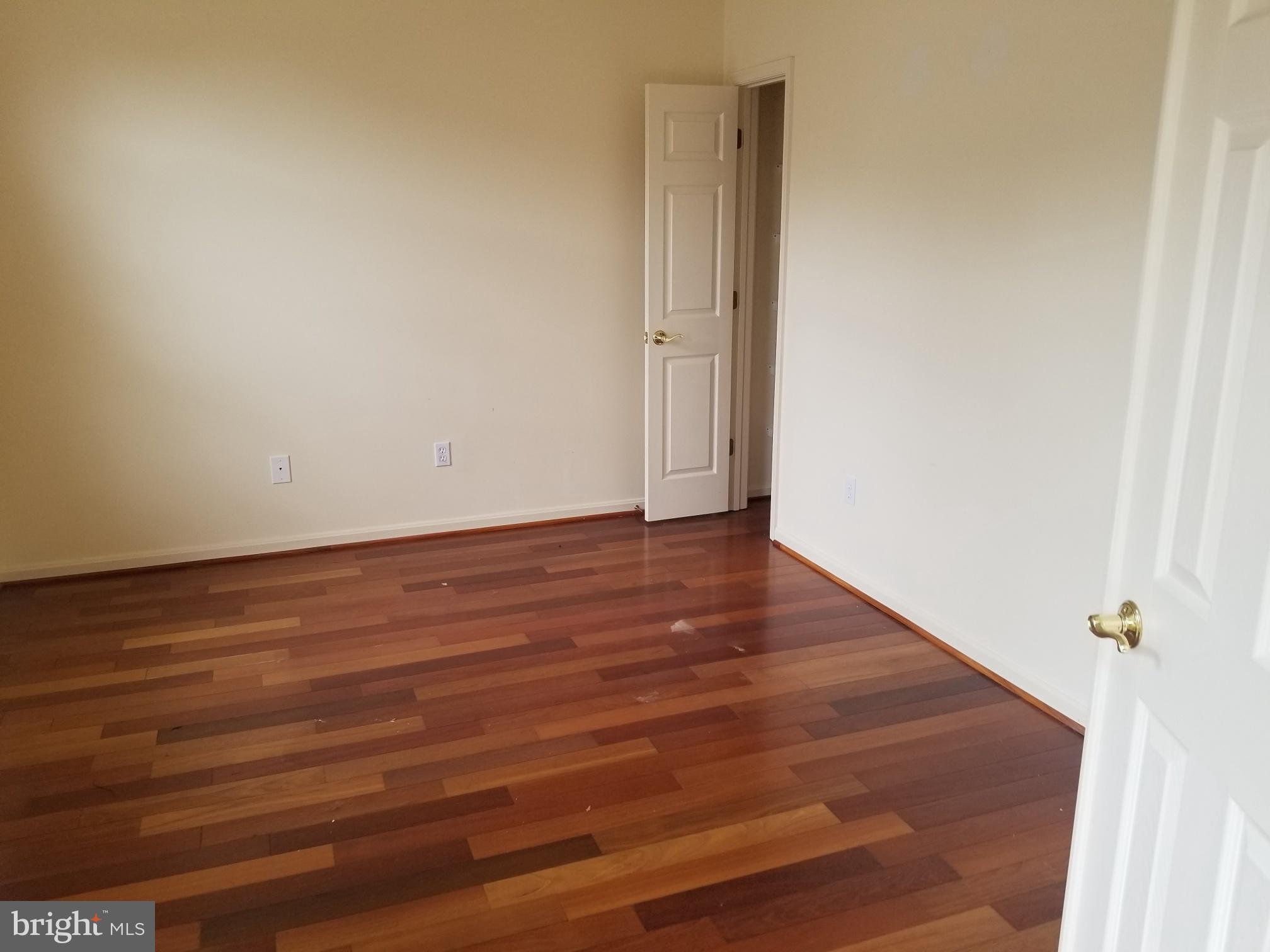 3943 Nelson House Road Ellicott City, MD 21043 - Photo 9 of 61 a view of an empty room with wooden floor