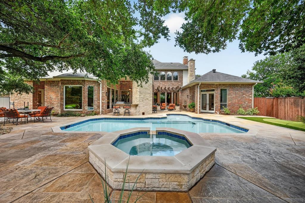 6416 Riverside Drive Plano, TX 75024 - Photo 29 of 35 Expansive backyard featuring a custom pool and spa with blue tile accents