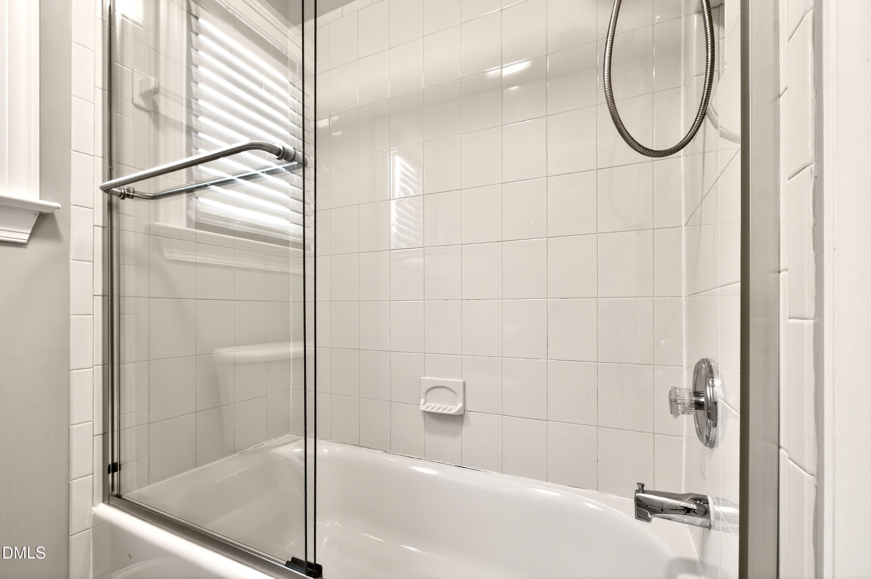 12408 Cilcain Court Raleigh, NC 27614 - Photo 39 of 80 a bathroom with a glass shower door