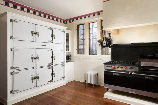 a kitchen with stainless steel appliances a refrigerator and cabinets