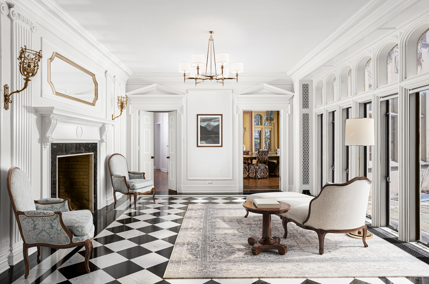 2122 West Hopkins Place Chicago, IL 60643 - Photo 9 of 36 a living room with furniture a fireplace and a chandelier