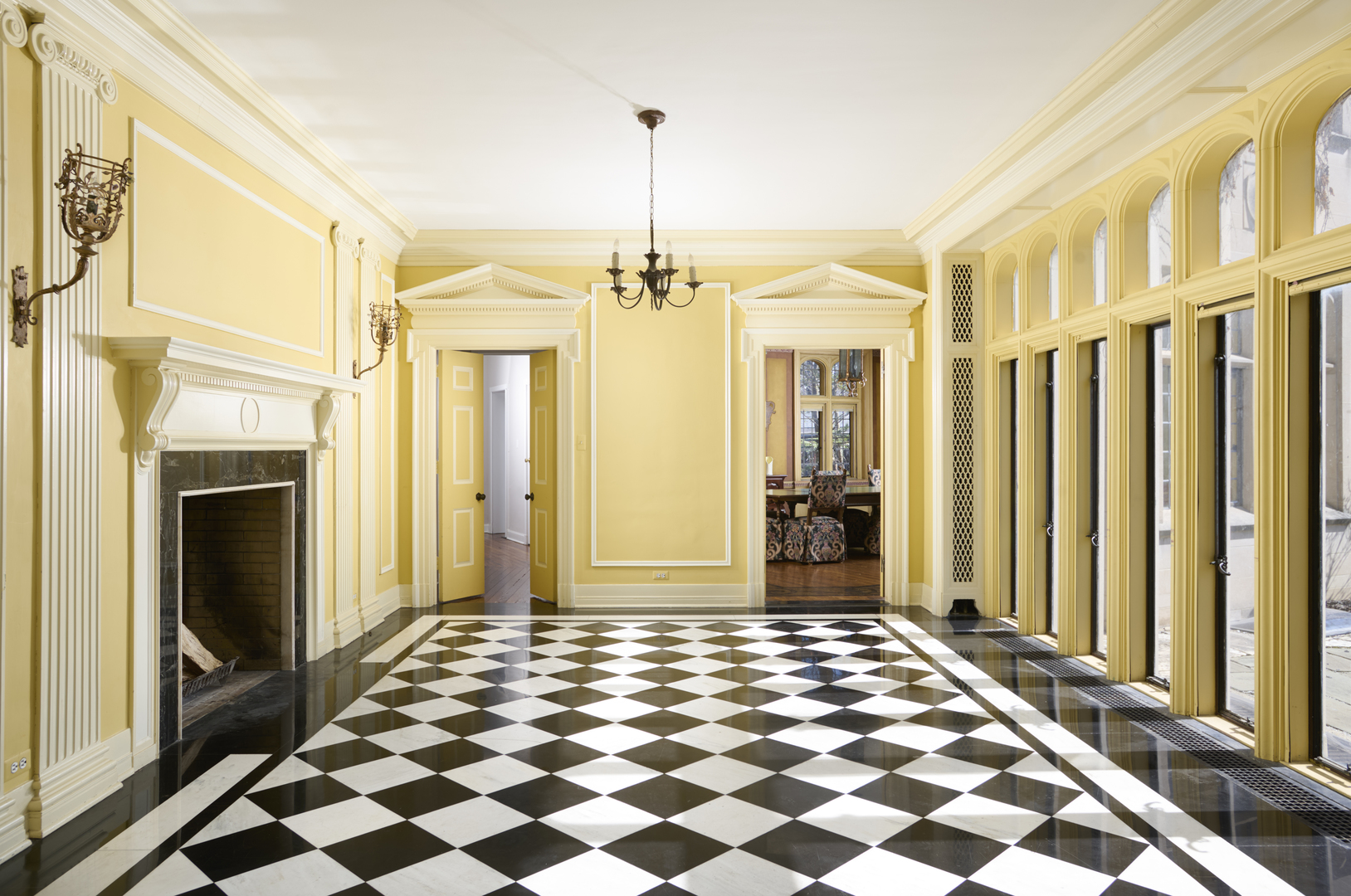 2122 West Hopkins Place Chicago, IL 60643 - Photo 10 of 36 a view of a hallway with wooden floor and a fireplace