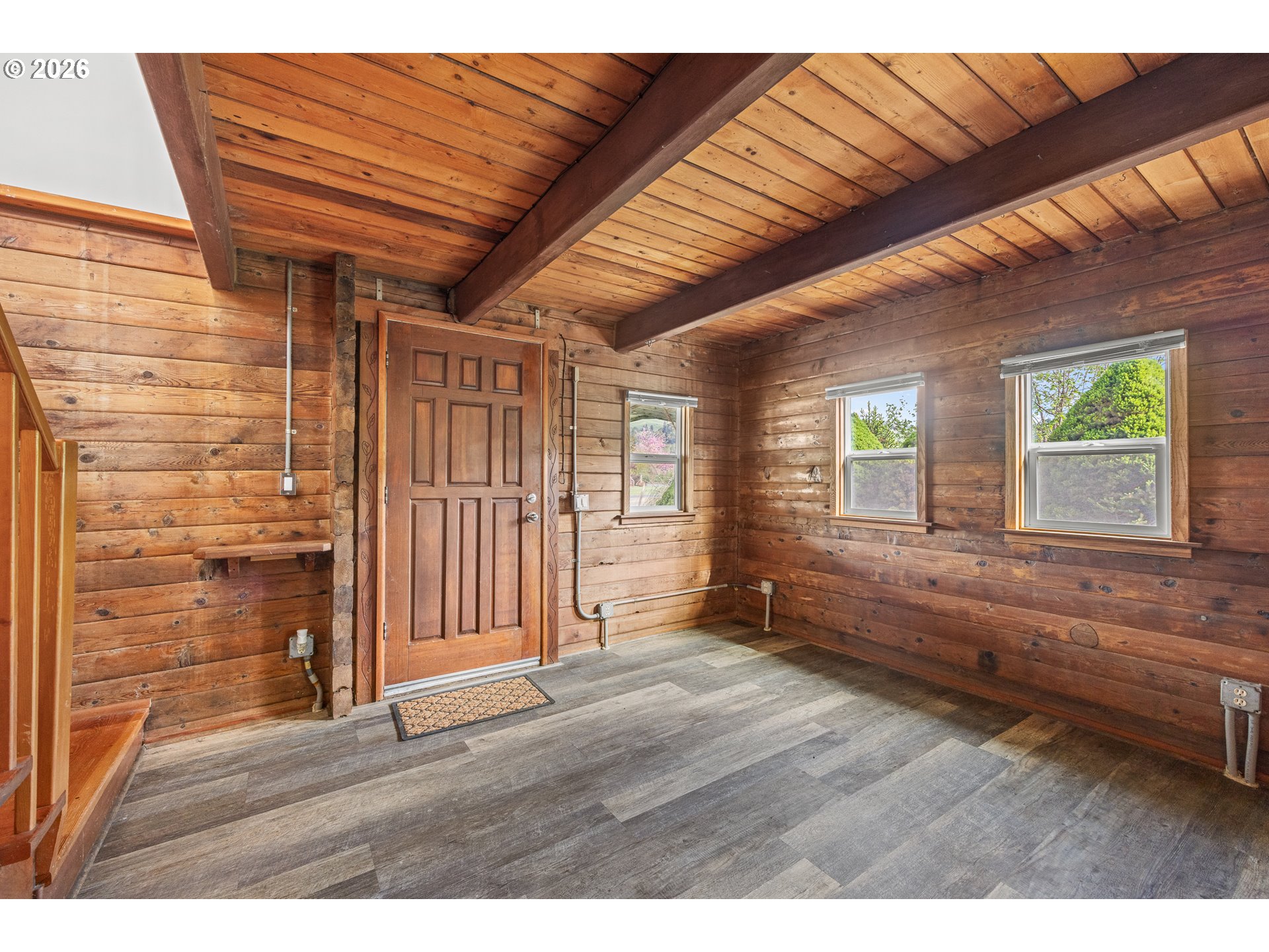1250 North 3rd Avenue Powers, OR 97466 - Photo 16 of 48 a view of an empty room with wooden floor and a window