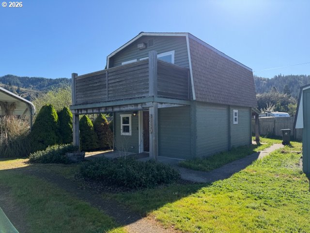 1250 North 3rd Avenue Powers, OR 97466 - Photo 2 of 48 a front view of a house with garden