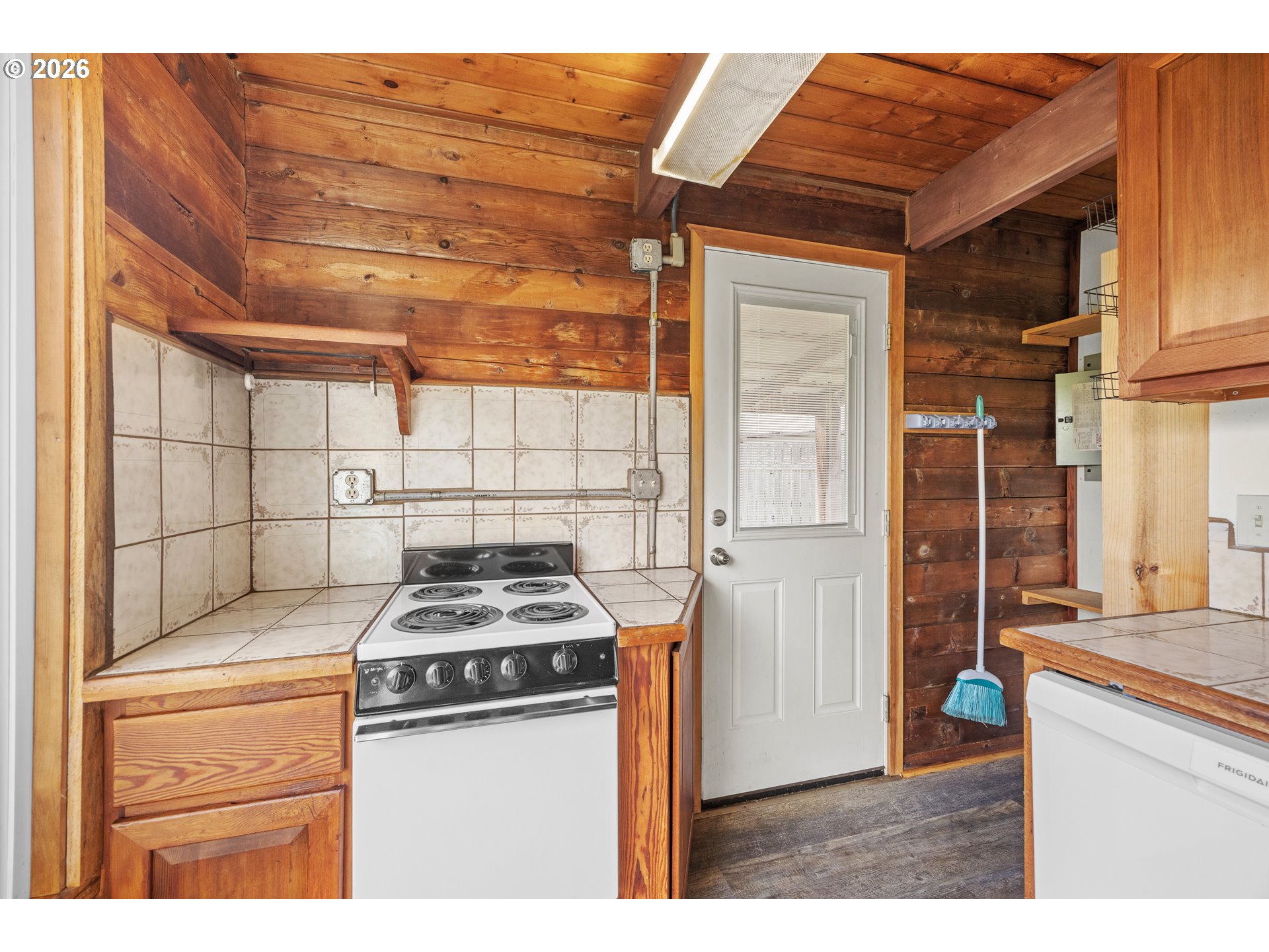 1250 North 3rd Avenue Powers, OR 97466 - Photo 21 of 48 a kitchen with a stove and a microwave