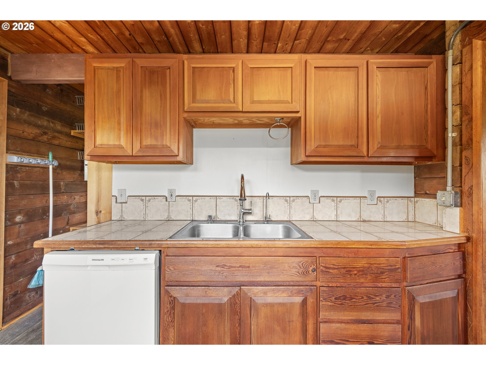 1250 North 3rd Avenue Powers, OR 97466 - Photo 22 of 48 a kitchen with stainless steel appliances granite countertop a sink and cabinets