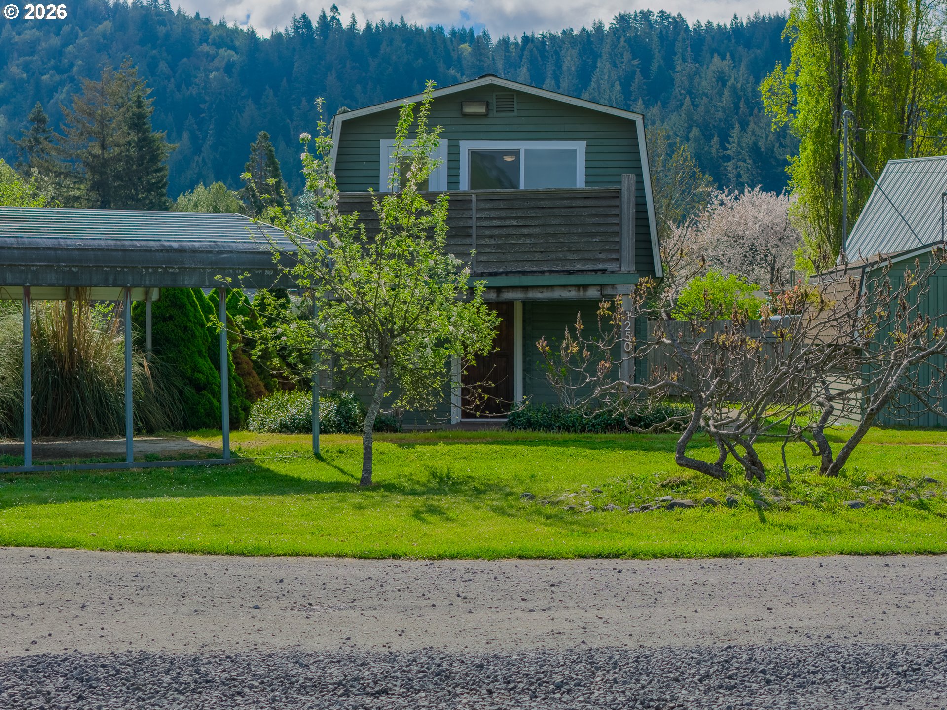 1250 North 3rd Avenue Powers, OR 97466 - Photo 4 of 48 a front view of a house with a yard