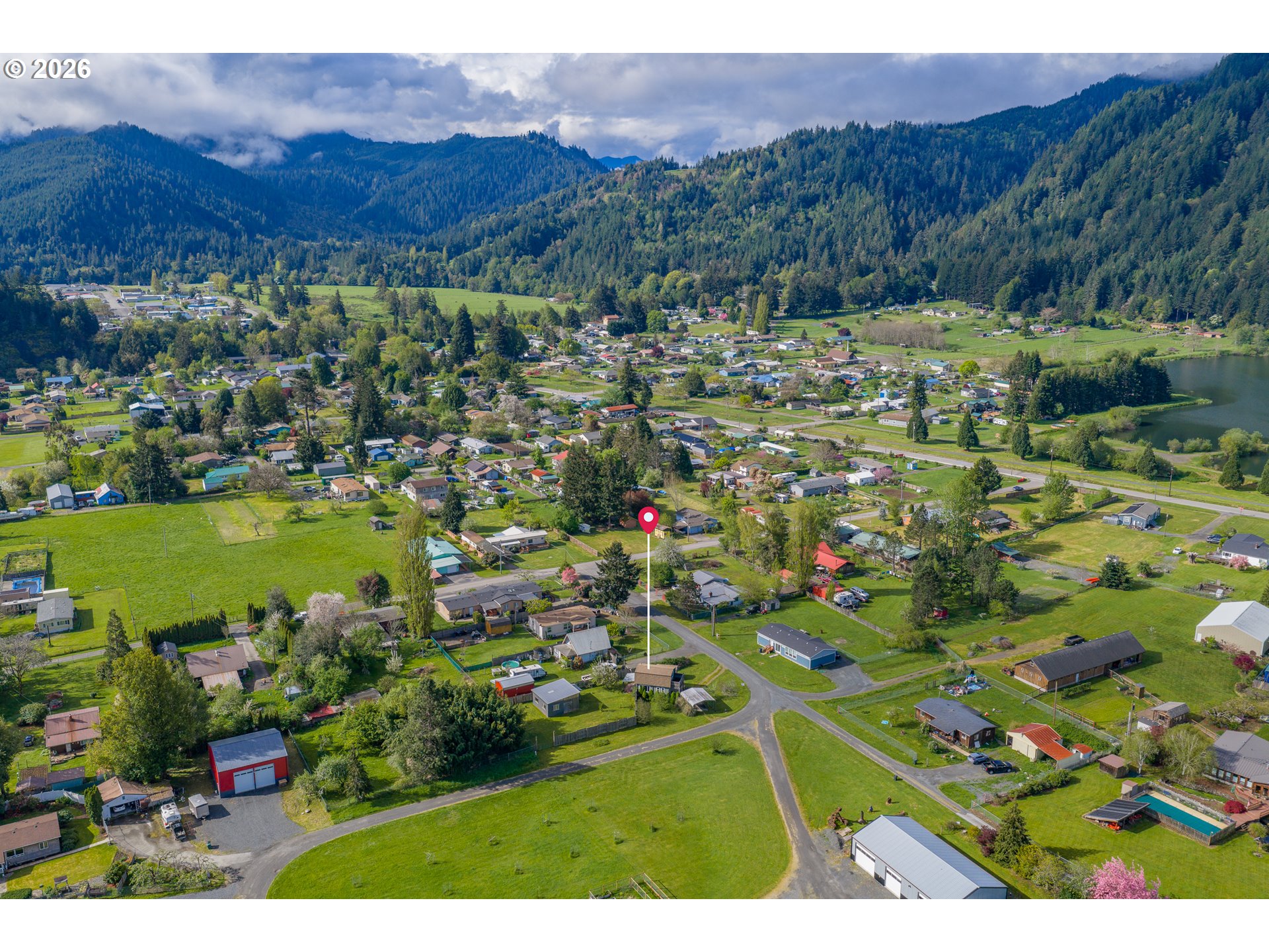 1250 North 3rd Avenue Powers, OR 97466 - Photo 45 of 48 a view of a city with mountains in the background
