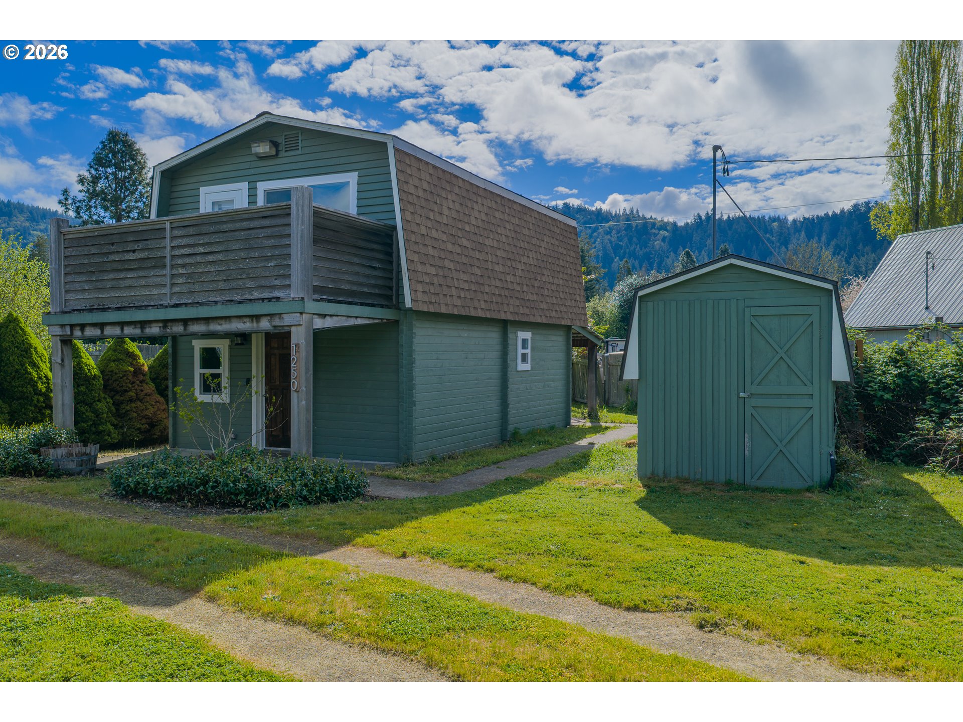 1250 North 3rd Avenue Powers, OR 97466 - Photo 7 of 48 a front view of a house with a yard