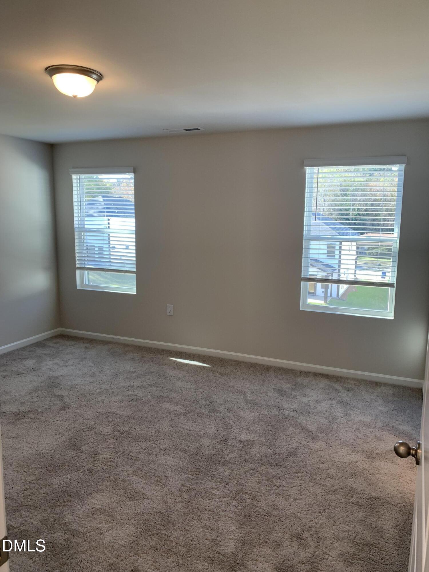 422 Diversity Way Raleigh, NC 27610 - Photo 8 of 10 an empty room with a window