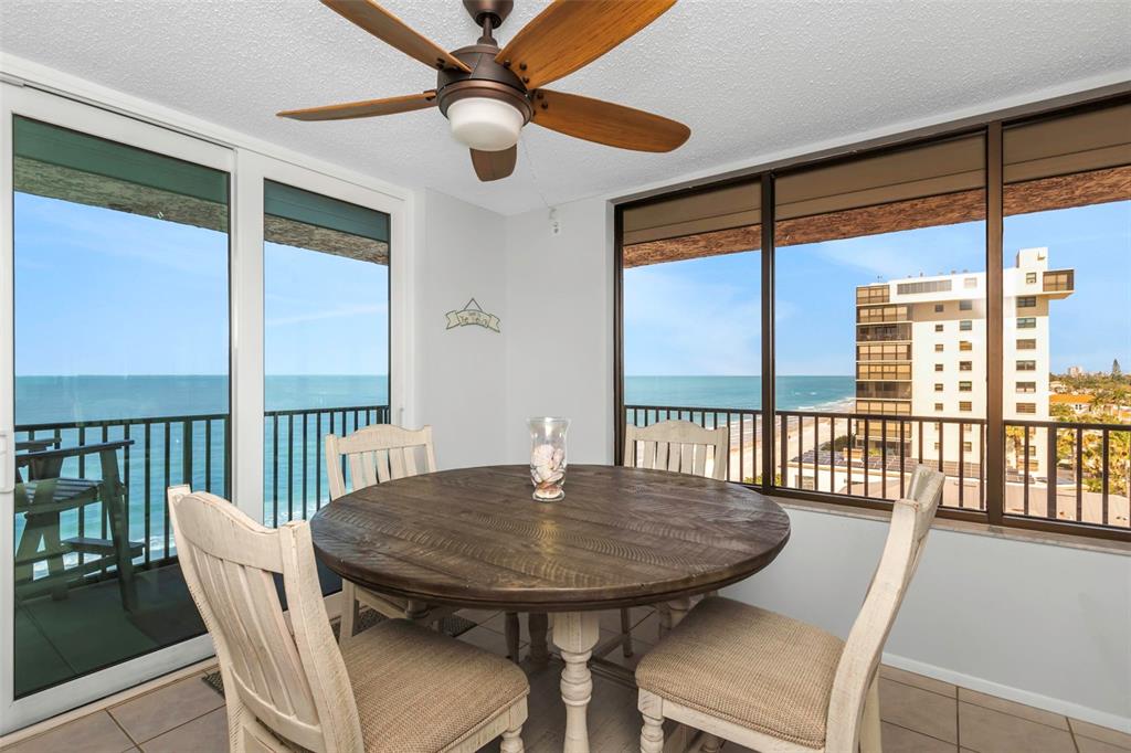 15316 Gulf Boulevard, Unit 604 Madeira Beach, FL 33708 - Photo 21 of 82 a view of a dining room with furniture window and outside view