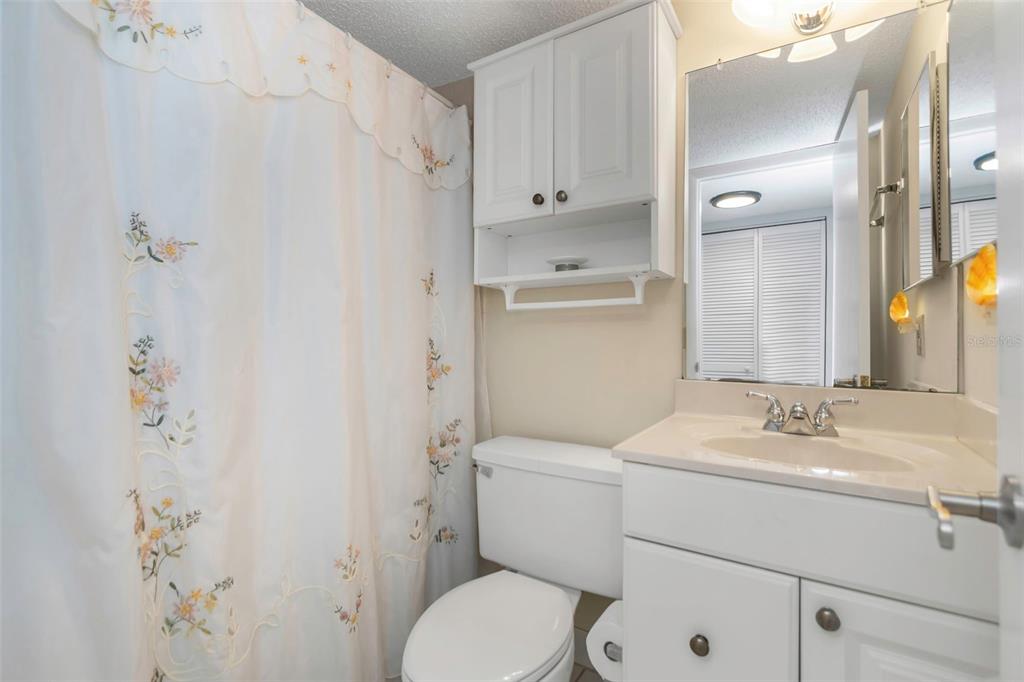 15316 Gulf Boulevard, Unit 604 Madeira Beach, FL 33708 - Photo 43 of 82 a bathroom with a sink toilet and shower