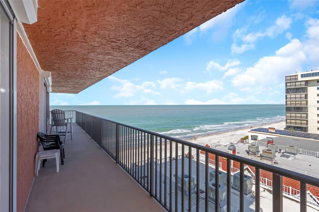 15316 Gulf Boulevard, Unit 604 Madeira Beach, FL 33708 - Photo 53 of 82 a view of roof deck with wooden floor and fence
