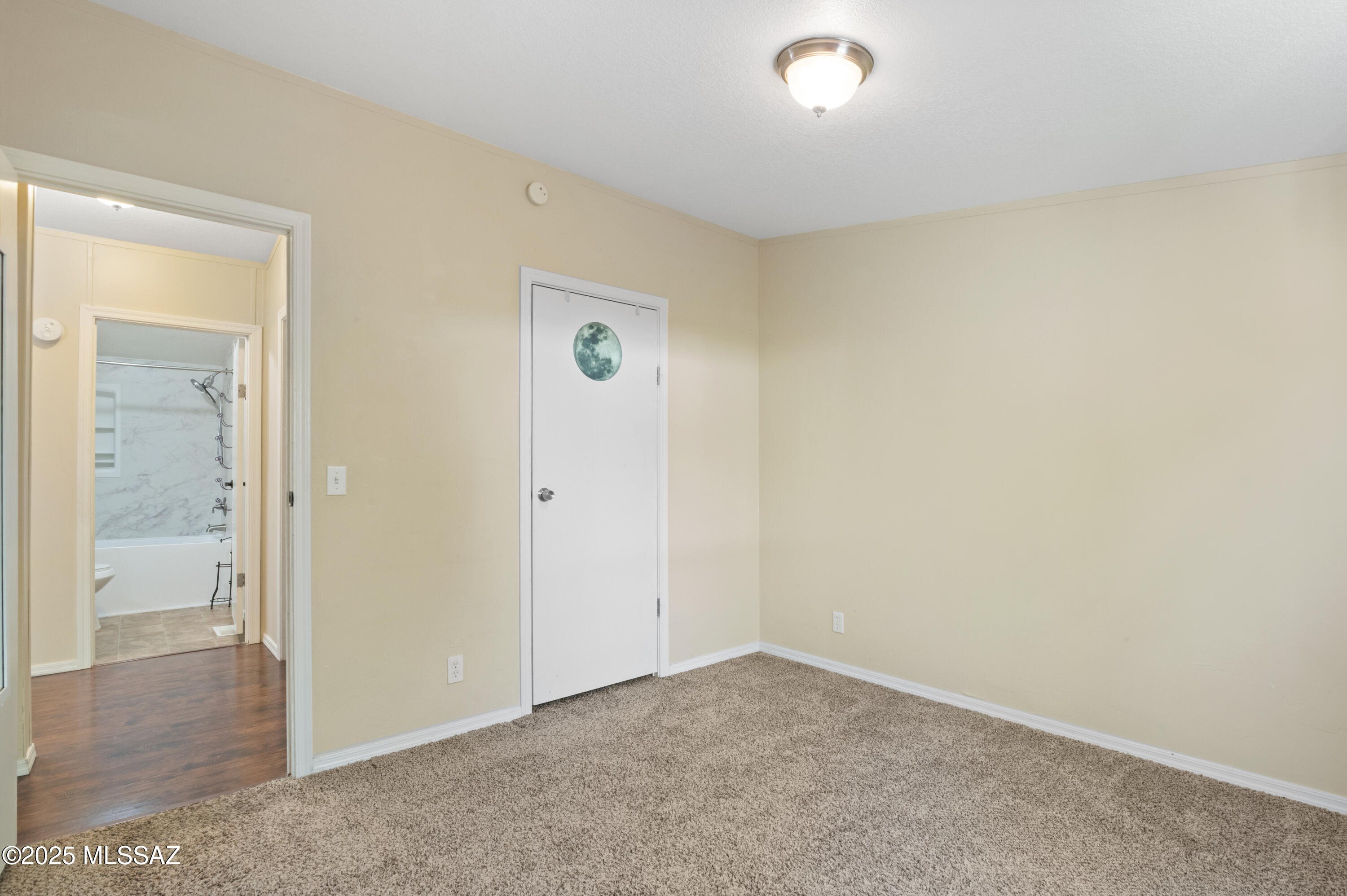 6205 East Rough Rock Drive Tucson, AZ 85756 - Photo 14 of 30 an empty room with closet and a window