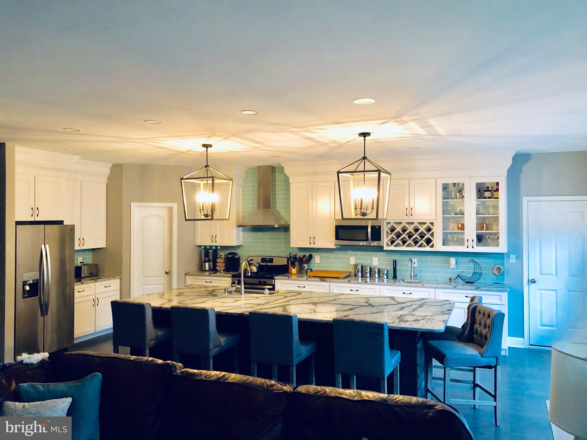 9 Patriots Way Georgetown, DE 19947 - Photo 18 of 67 a kitchen with sink and refrigerator