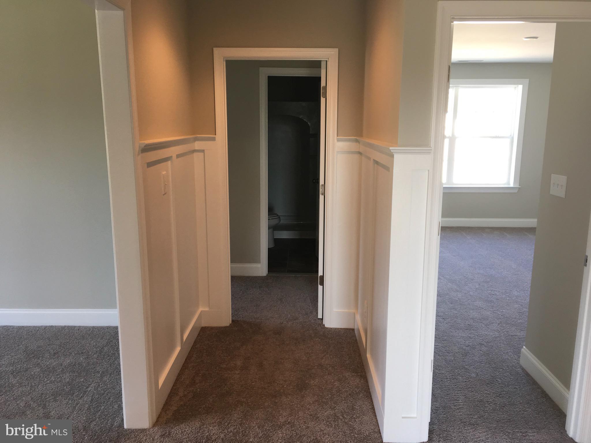 9 Patriots Way Georgetown, DE 19947 - Photo 47 of 67 a view of a hallway with wooden floor