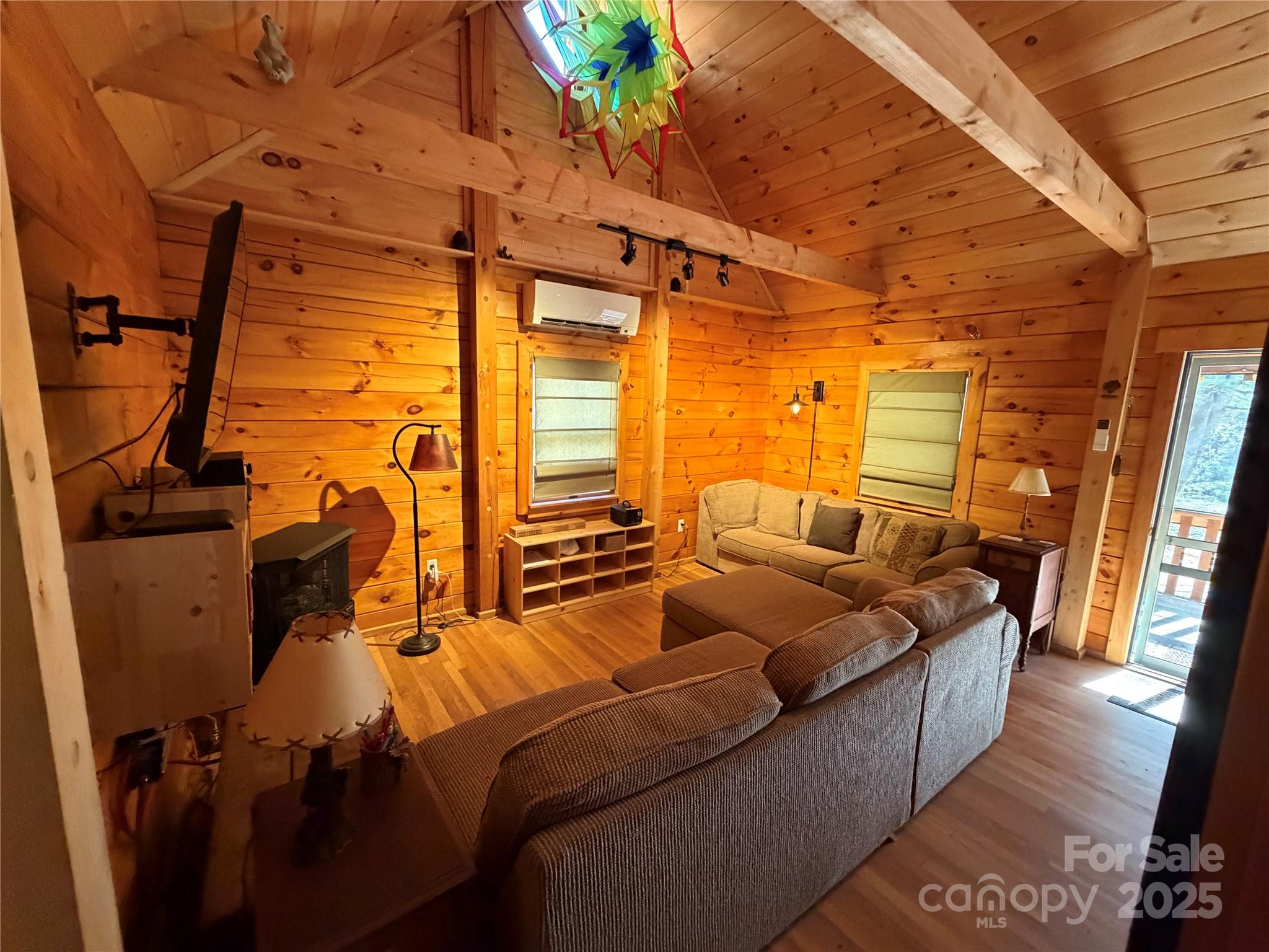 1917 Longbottom Road McGrady, NC 28649 - Photo 17 of 32 a living room with furniture and a floor to ceiling window