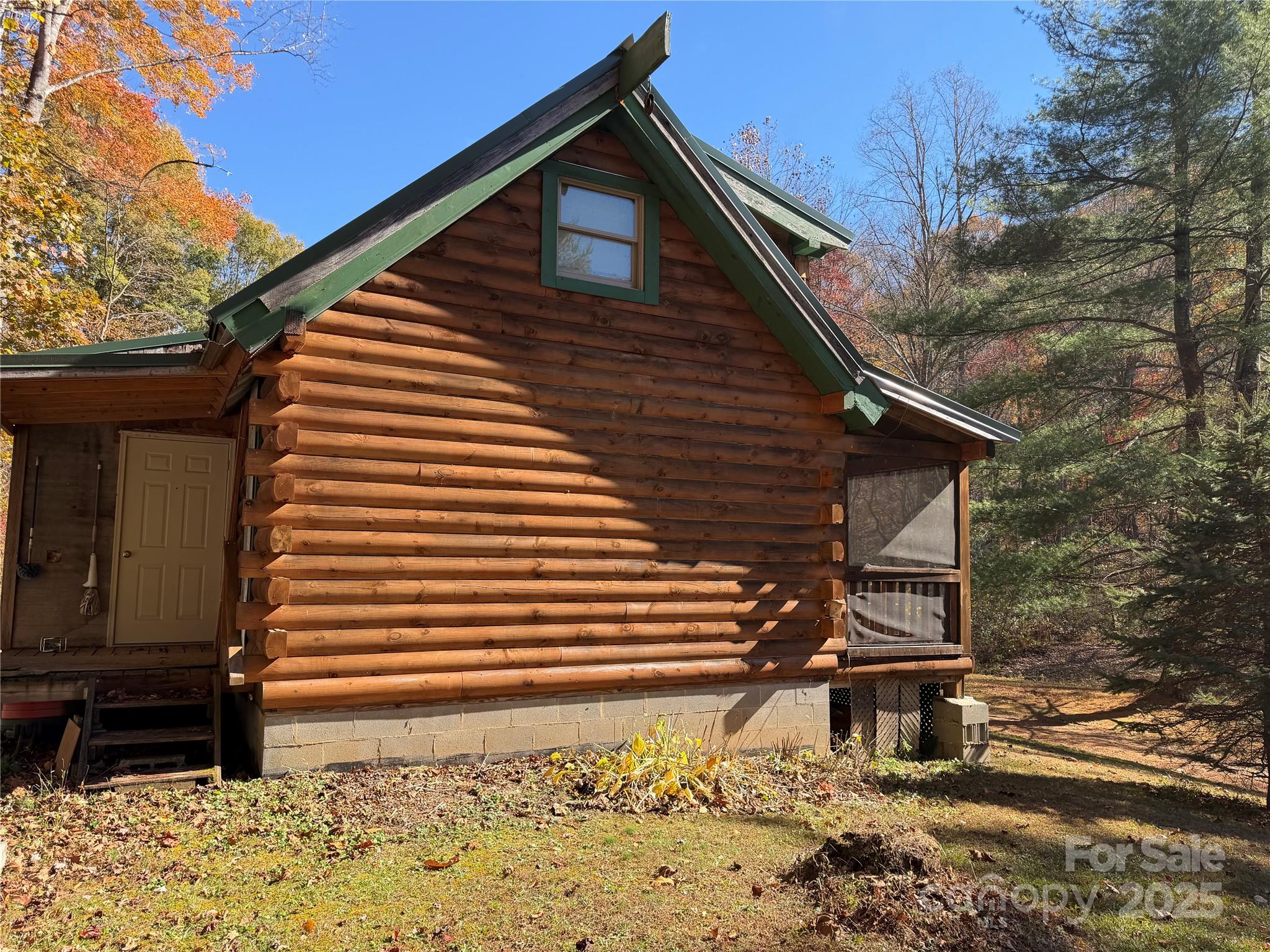 1917 Longbottom Road McGrady, NC 28649 - Photo 19 of 32 a backyard of a house with a tree