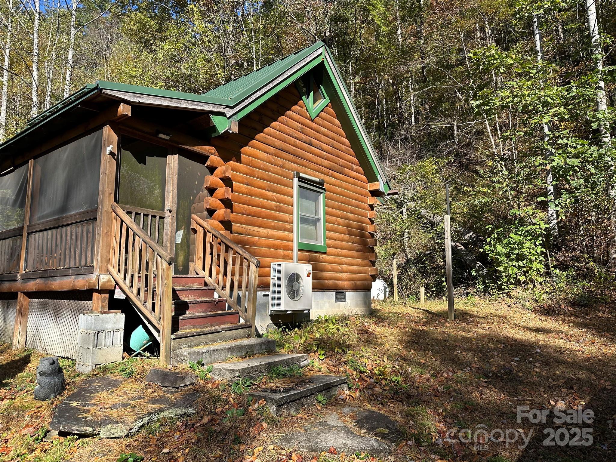 1917 Longbottom Road McGrady, NC 28649 - Photo 30 of 32 a view of house with backyard and deck