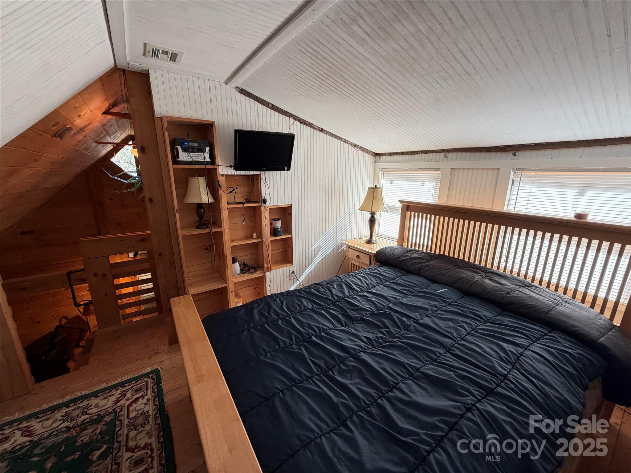 1917 Longbottom Road McGrady, NC 28649 - Photo 7 of 32 a view of a livingroom with wooden floor and stairs