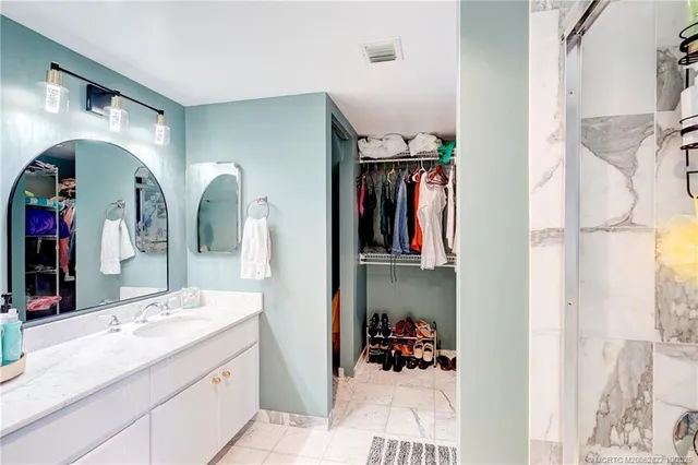 a bedroom with a bed and a table