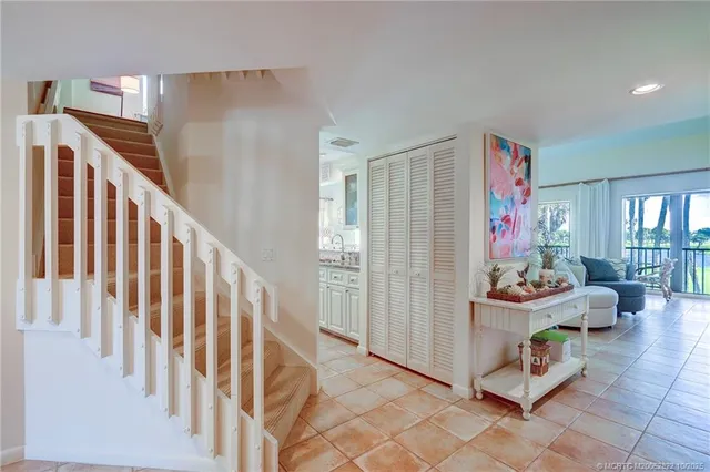 a bedroom with a large bed and a dresser