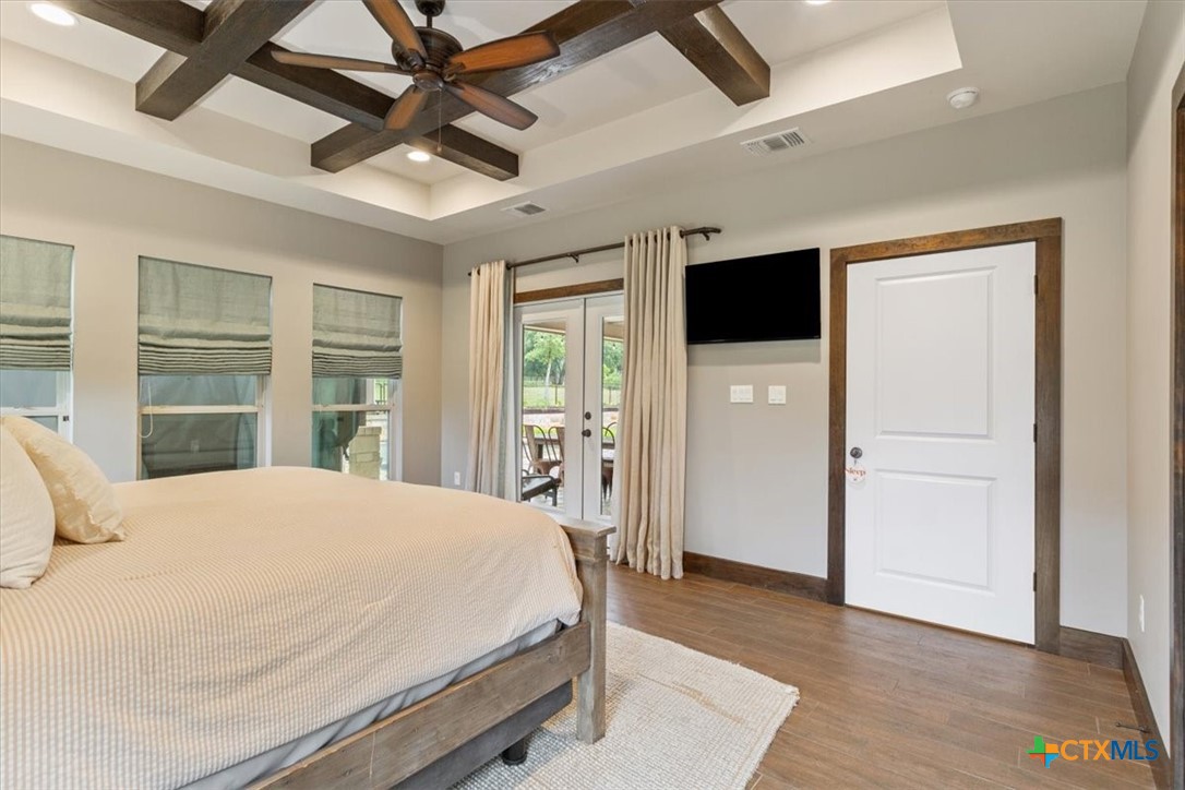 569 Messer Ranch Road Belton, TX 76513 - Photo 16 of 48 a bedroom with a bed and a large window
